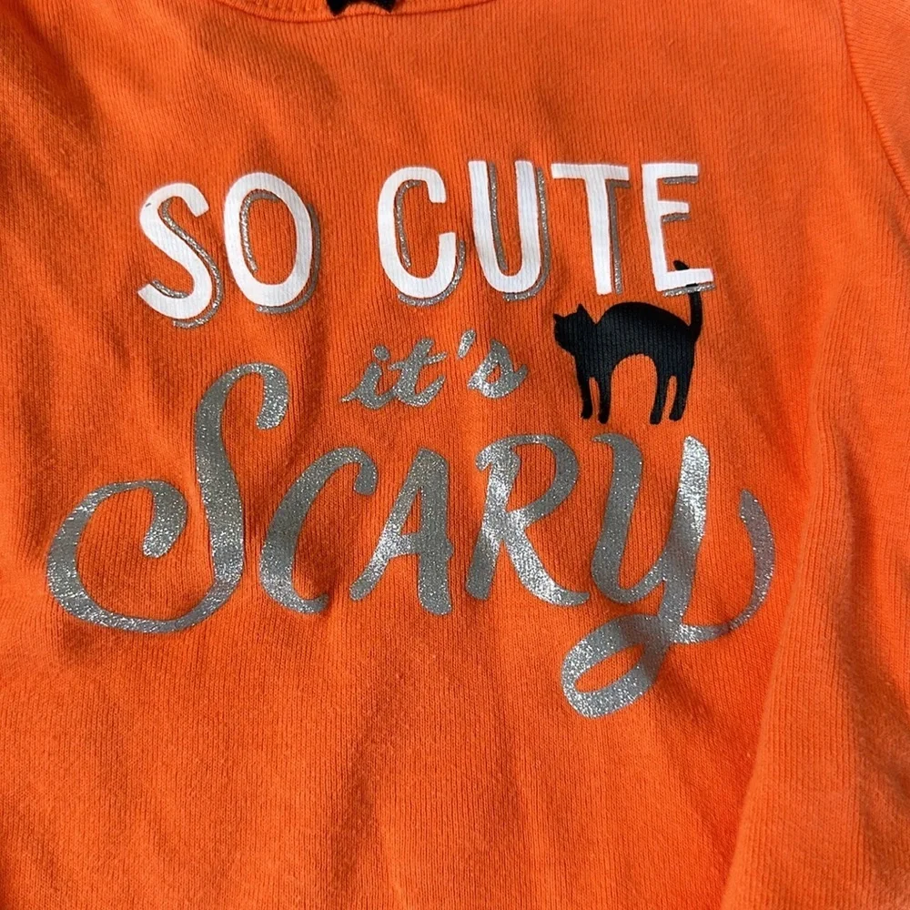 Bundle of my first Halloween clothes. Two long sleeve onesies and a tutu shirt.